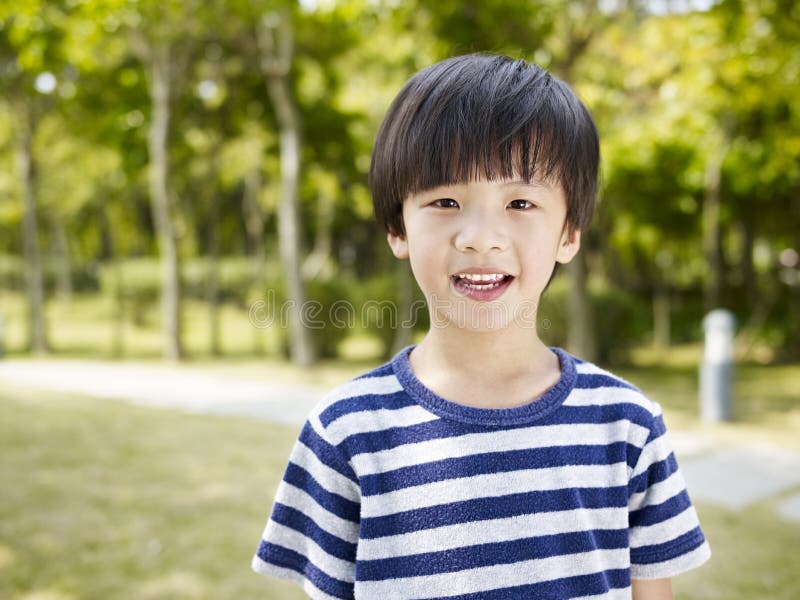 Outdoor portrait of a little asian boy. Outdoor portrait of a little asian boy.