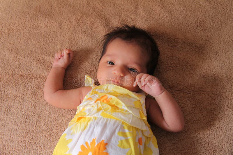New born baby girl in cute dress. Baby is one month old. Asian baby girl. New born baby girl in cute dress. Baby is one month old. Asian baby girl.