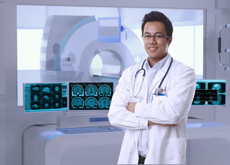 Portrait of asian doctor in MRI room at hospital, looking at camera, smiling. Portrait of asian doctor in MRI room at hospital, looking at camera, smiling.