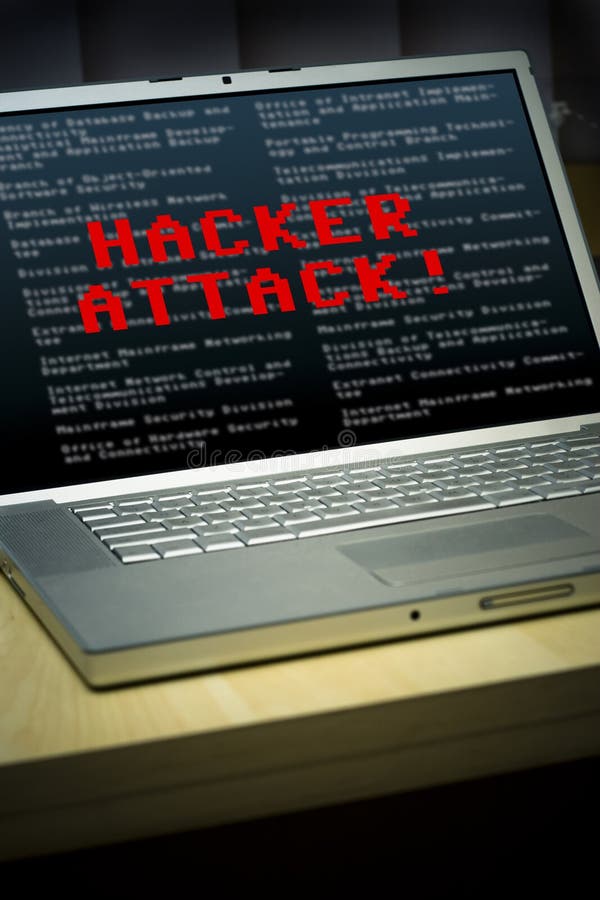 Laptop with 'hacker attack' message on the screen. Laptop with 'hacker attack' message on the screen.