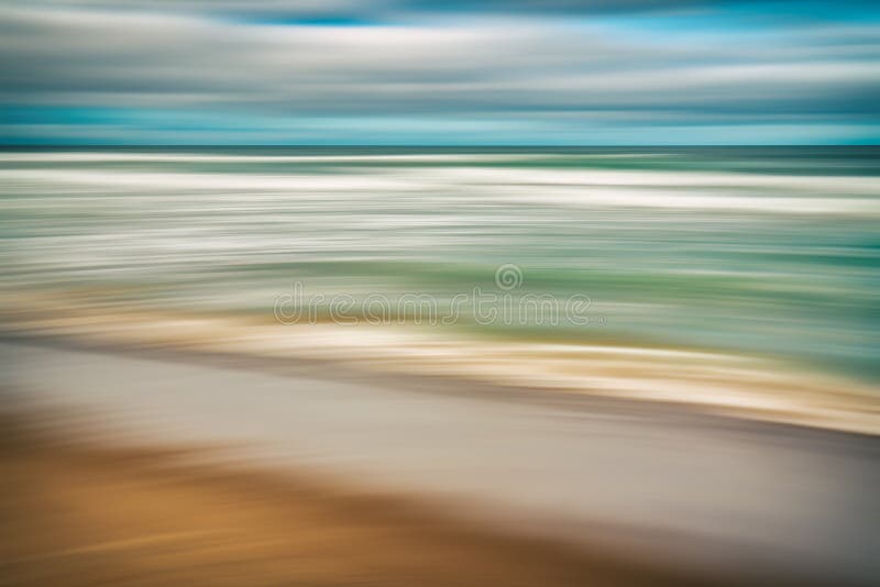 Abstract seascape. Idyllic tropical beach and beautiful cloudy sky. Blue, turquoise, and orange colors. Motion blur, water surface, reflection, line art. Abstract seascape. Idyllic tropical beach and beautiful cloudy sky. Blue, turquoise, and orange colors. Motion blur, water surface, reflection, line art