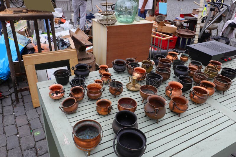 copper vases and cauldrons for sale in the antique dealer s stall in the alfresco flea market. copper vases and cauldrons for sale in the antique dealer s stall in the alfresco flea market