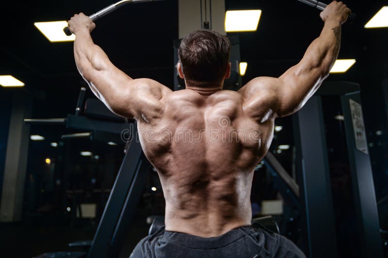 Βάναυσα ισχυρά αθλητικά άτομα bodybuilder που αντλούν επάνω τους μυς με το δ στοκ φωτογραφία Βάναυσα ισχυρά αθλητικά άτομα bodybuilder που αντλούν επάνω τους μυς με το δ στοκ φωτογραφία