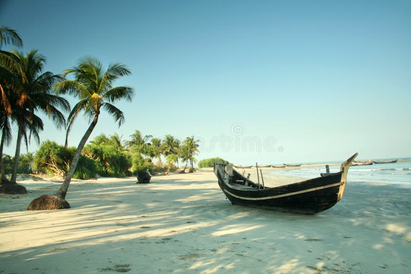 Boat resting on a beach on St. Martins Island, Bangladesh. Boat resting on a beach on St. Martins Island, Bangladesh
