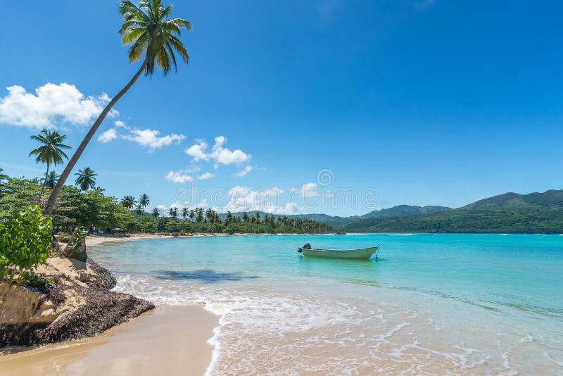 Boat on turquoise Caribbean sea, Playa Rincon, Dominican Republic, vacation, holidays, palm trees, beach. Boat on turquoise Caribbean sea, Playa Rincon, Dominican Republic, vacation, holidays, palm trees, beach.