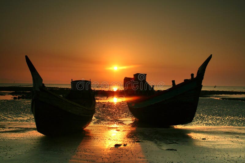 Two boats resting on a beach on St. Martins Island, Bangladesh. Two boats resting on a beach on St. Martins Island, Bangladesh