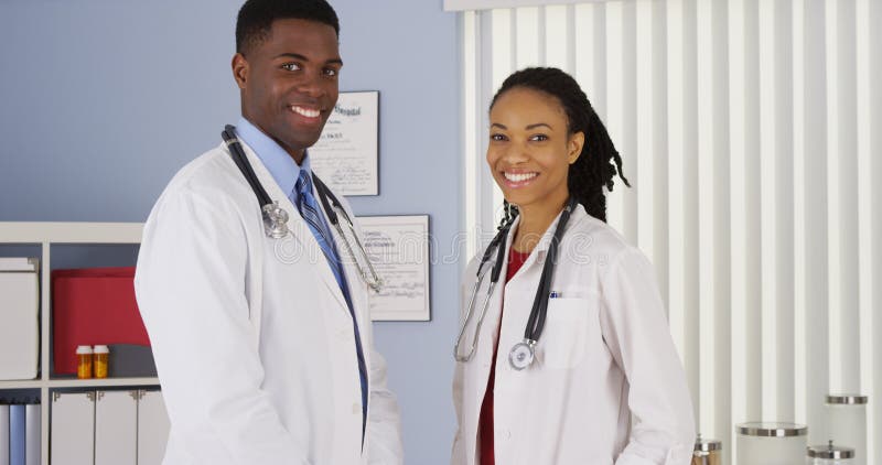 Confident African American medical professionals in hospital. Confident African American medical professionals in hospital