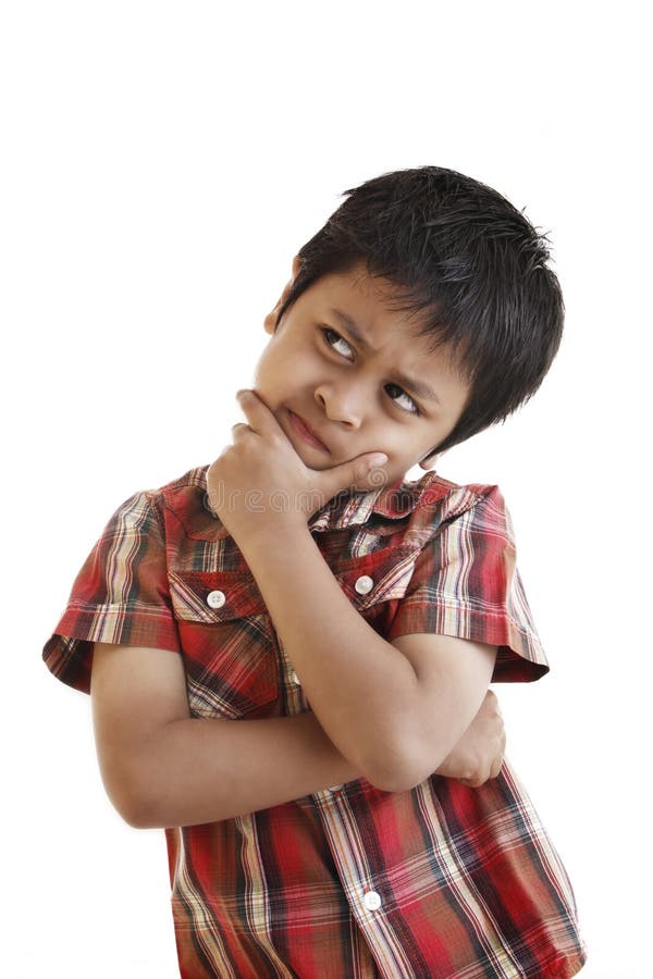 A young asian boy is doing a deep thinking. Studio shot over white background. A young asian boy is doing a deep thinking. Studio shot over white background.