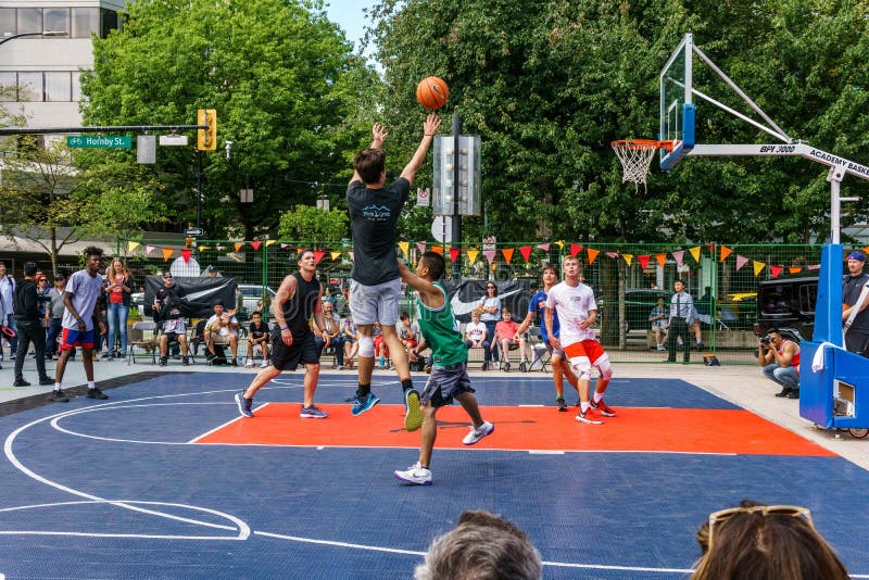 VANCOUVER, CANADA - JULY 1, 2018: Athletes play street basketball in Vancouver Canada Day. VANCOUVER, CANADA - JULY 1, 2018: Athletes play street basketball in Vancouver Canada Day