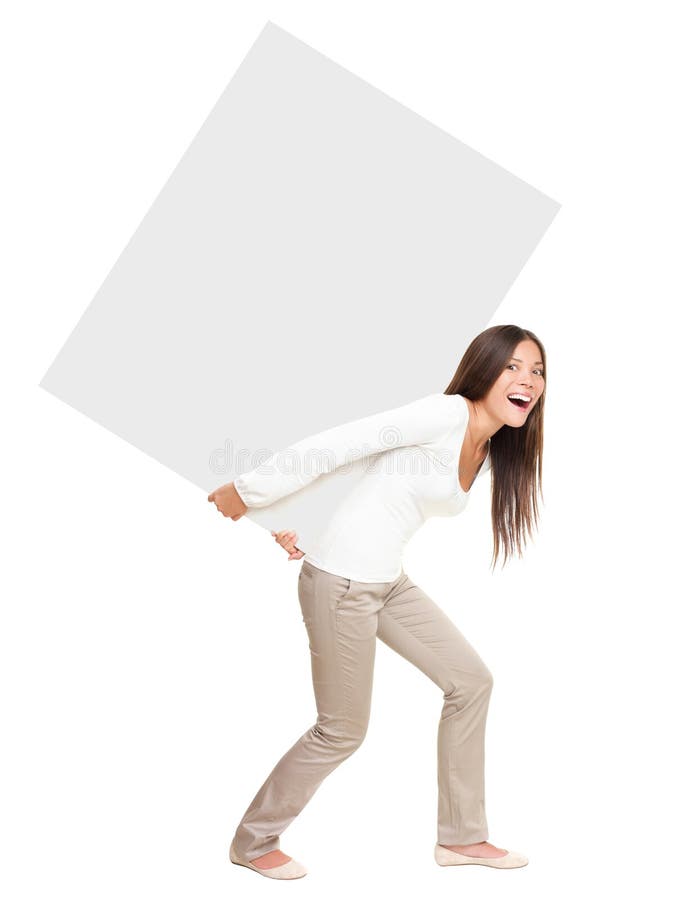 Woman lifting / showing heavy blank billboard sign. Pretty casual woman carrying empty sign board on her back. Funny image of beautiful asian caucasian female model isolated in full length on white background. Woman lifting / showing heavy blank billboard sign. Pretty casual woman carrying empty sign board on her back. Funny image of beautiful asian caucasian female model isolated in full length on white background.