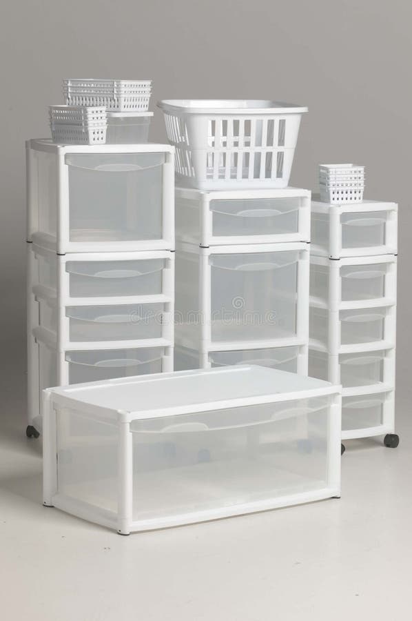 Stacks of white and clear plastic storage containers for the home. Stacks of white and clear plastic storage containers for the home