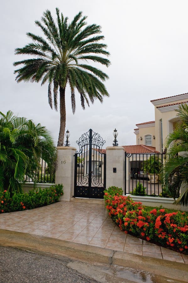 Exterior details of luxurious tropical home pictured on rainy day, Aruba island, Lesser Antilles. Exterior details of luxurious tropical home pictured on rainy day, Aruba island, Lesser Antilles.