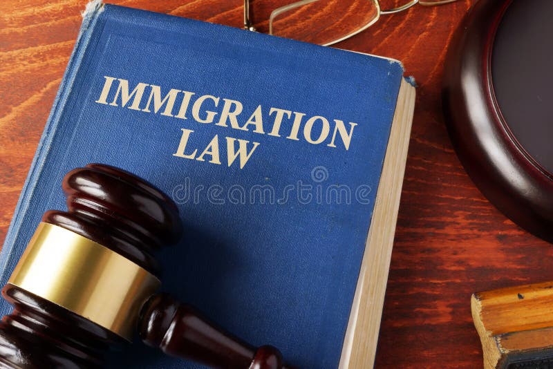 Book with title immigration law on a table. Book with title immigration law on a table.
