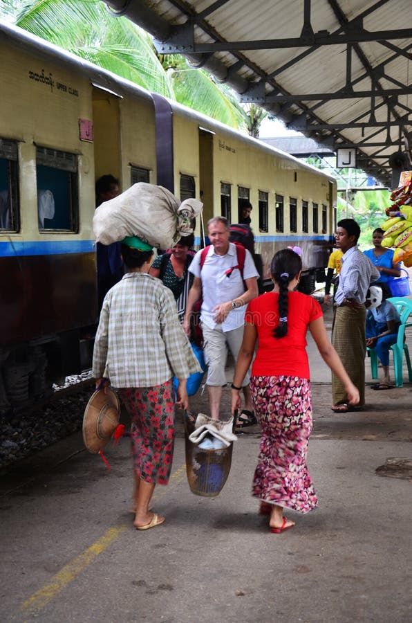 Burmese people waiting train and selling product at railway station in Bago, Myanmar. Bago formerly Pegu, is a city and the capital of Bago Region in Myanmar (Burma). It is located 50 miles (80 km) north-east of Yangon. Bago (formerly Pegu) is the capital city of Bago Division in the Irrawaddy region of Myanmar. On the main road between North and South Myanmar, this is a highly noisy and trafficked town. From Yangon, leave in the morning by taxi (US$40-50), or by bus (from the corner of Strand and Sule Pagoda Road and also from the Aung Mingalar Bus Terminal), or by train (US$4 upper class, US$1 for ordinary seat, all Mandalay and Mawlamyine bound trains stop there). A taxi is the best because youll need one to see the sights in Bago (which are quite far apart) and you can stop at Taukkyan on the way. Burmese people waiting train and selling product at railway station in Bago, Myanmar. Bago formerly Pegu, is a city and the capital of Bago Region in Myanmar (Burma). It is located 50 miles (80 km) north-east of Yangon. Bago (formerly Pegu) is the capital city of Bago Division in the Irrawaddy region of Myanmar. On the main road between North and South Myanmar, this is a highly noisy and trafficked town. From Yangon, leave in the morning by taxi (US$40-50), or by bus (from the corner of Strand and Sule Pagoda Road and also from the Aung Mingalar Bus Terminal), or by train (US$4 upper class, US$1 for ordinary seat, all Mandalay and Mawlamyine bound trains stop there). A taxi is the best because youll need one to see the sights in Bago (which are quite far apart) and you can stop at Taukkyan on the way.