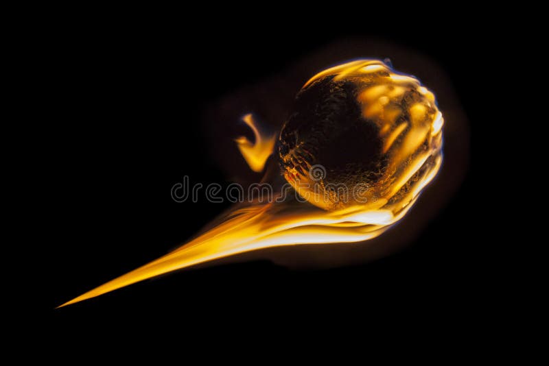 Flaming fireball fastball baseball burning into darkness. Flaming fireball fastball baseball burning into darkness.