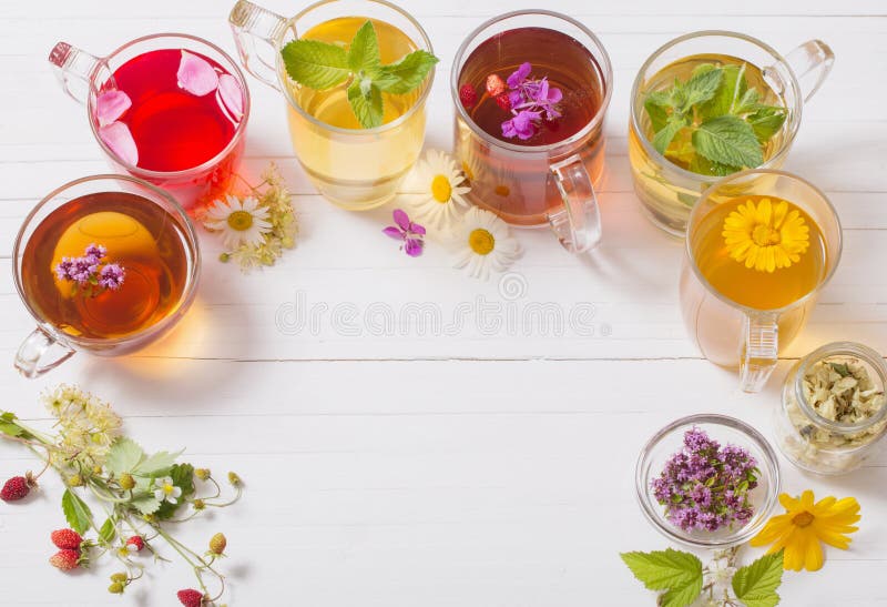 Herbal tea in cups on a white background. Herbal tea in cups on a white background