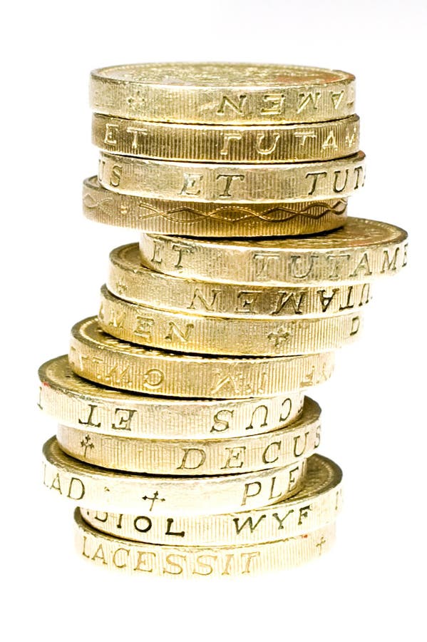 A pile of british pound coins on a white background. A pile of british pound coins on a white background