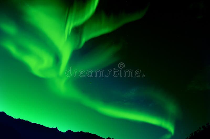 Northern Lights over mountain at night. Northern Lights over mountain at night