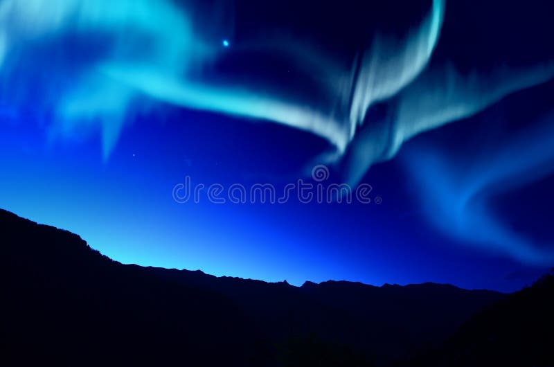 Northern Lights over mountain at night. Northern Lights over mountain at night