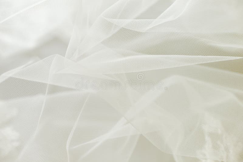 Ivory wedding tulle or chiffon background. Ivory wedding tulle or chiffon background