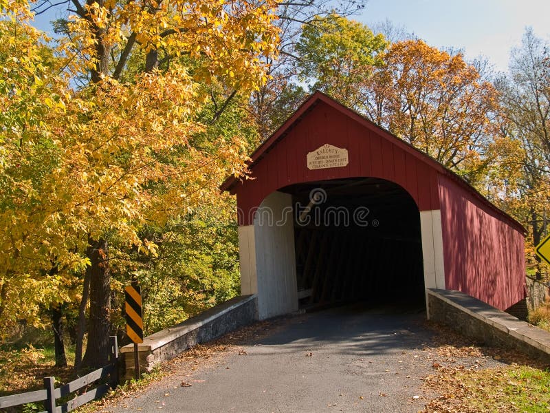 An Autumn view of the historic Knechts Covered Bridge in rural Bucks County, Pennsylvania. An Autumn view of the historic Knechts Covered Bridge in rural Bucks County, Pennsylvania.