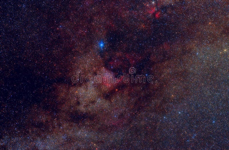 Milky way in Cygnus (Swan) constellation with stars, nebulae (including famous North America - NGC 7000 - hydrogen nebula at the center) and cosmic dust clouds. The brightest blue star is Deneb. Photo has been taken by Canon 450d camera with lens Helios-44 and with exposure jf several hours. Landscape orientation. Milky way in Cygnus (Swan) constellation with stars, nebulae (including famous North America - NGC 7000 - hydrogen nebula at the center) and cosmic dust clouds. The brightest blue star is Deneb. Photo has been taken by Canon 450d camera with lens Helios-44 and with exposure jf several hours. Landscape orientation.