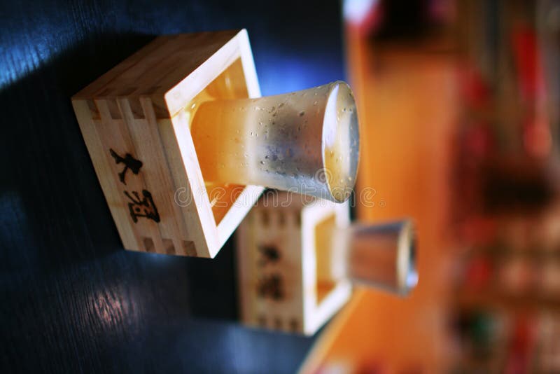 This picture was shot in a pub in japan.It exhibits Japanese culture.The sake was iced,then the glass of cups was reeked. This picture was shot in a pub in japan.It exhibits Japanese culture.The sake was iced,then the glass of cups was reeked.