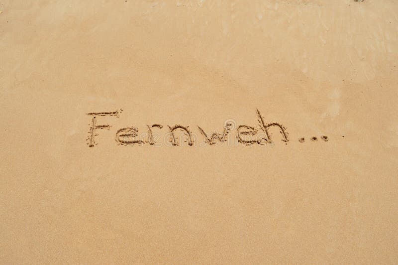 Γερμανική λέξη «Fernweh» στην άμμο
