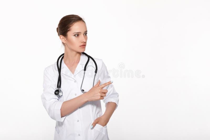 Γιατρός γυναικών που παρουσιάζει κάτι στοκ εικόνες Γιατρός γυναικών που παρουσιάζει κάτι στοκ εικόνες