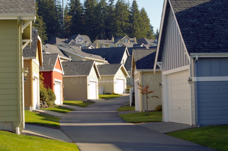 Residential neighborhood alleyway lined with colorful garages. Residential neighborhood alleyway lined with colorful garages.