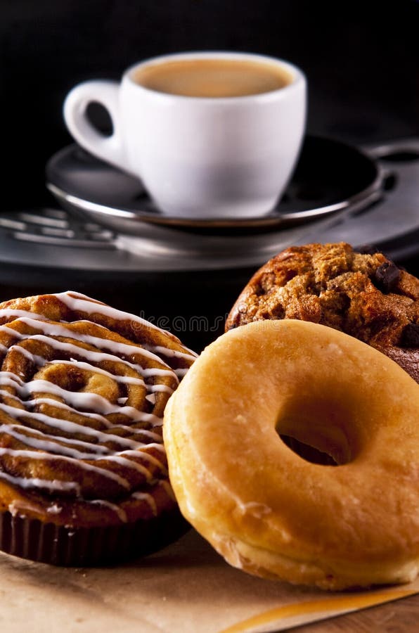 Fresh doughnut and cookies with an espresso. Fresh doughnut and cookies with an espresso