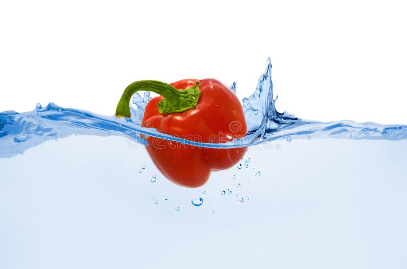 Sweet red pepper thrown in clean water with splash. Sweet red pepper thrown in clean water with splash
