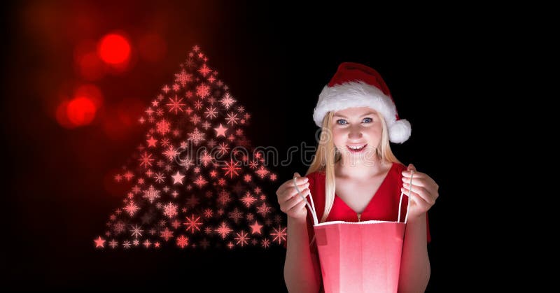 Γυναίκα Santa που κοιτάζει τσαντών και Snowflake δώρων στη μορφή σχεδίων χριστουγεννιάτικων δέντρων στοκ φωτογραφίες με δικαίωμα ελεύθερης χρήσης Γυναίκα Santa που κοιτάζει τσαντών και Snowflake δώρων στη μορφή σχεδίων χριστουγεννιάτικων δέντρων στοκ φωτογραφίες με δικαίωμα ελεύθερης χρήσης