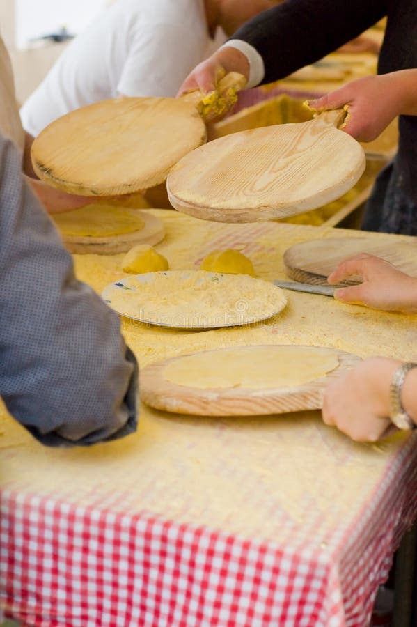 Womans making talos, Tortilla than wraps txistorra in the Santo Tomas Fair, held each year on December 21st in some parts of the Basque Country. Spain. Womans making talos, Tortilla than wraps txistorra in the Santo Tomas Fair, held each year on December 21st in some parts of the Basque Country. Spain