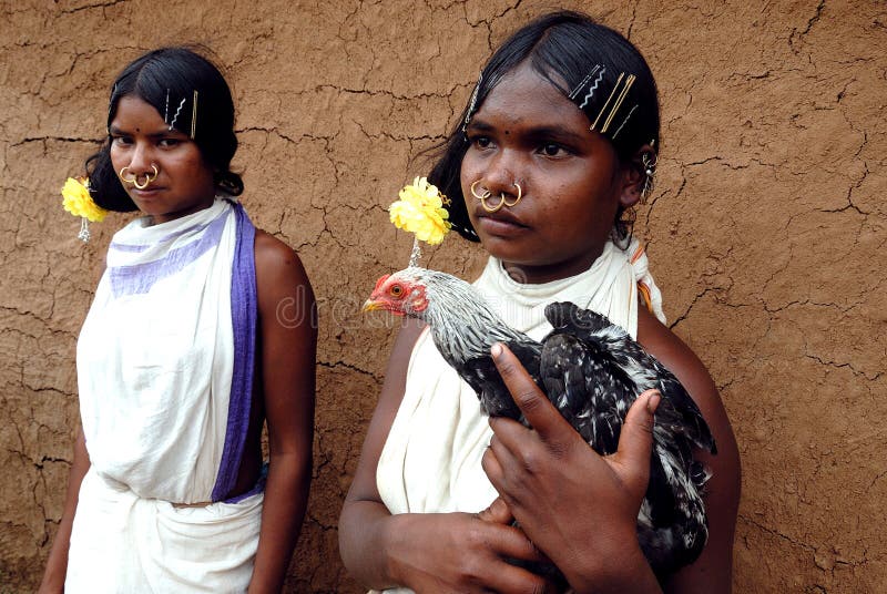 Women from the Dongria Kondh tribe in the village of Devapada on the slopes of Niyamgiri mountain in Orissa state, India. The mountain is regarded as sacred by the Dongria Kondh tribe which relies on the jungle which cloaks its slopes for their livelihood. Women from the Dongria Kondh tribe in the village of Devapada on the slopes of Niyamgiri mountain in Orissa state, India. The mountain is regarded as sacred by the Dongria Kondh tribe which relies on the jungle which cloaks its slopes for their livelihood.