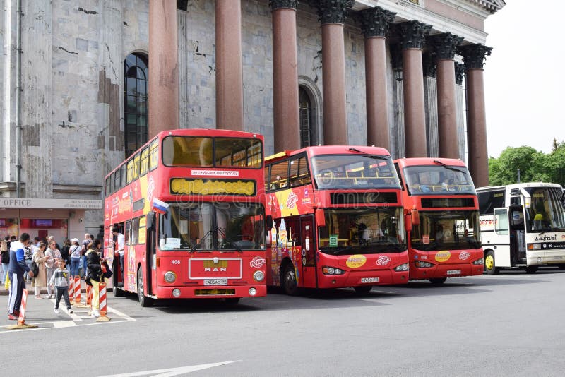 St. Petersburg, Russia - June 18, 2022. Sightseeing red double-decker buses in the parking lot on the square near St. Isaac`s Cathedral. St. Petersburg, Russia - June 18, 2022. Sightseeing red double-decker buses in the parking lot on the square near St. Isaac`s Cathedral.