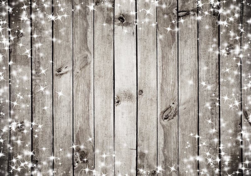 The brown wood texture with white snow and stars. Christmas background. The brown wood texture with white snow and stars. Christmas background