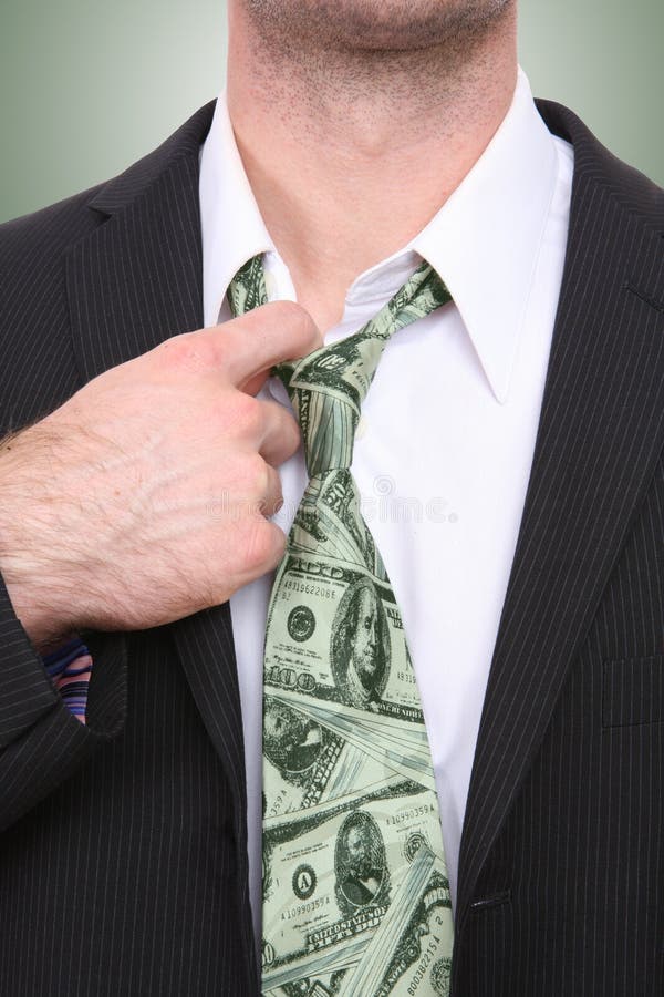 A business man with a conceptual money themed tie. A business man with a conceptual money themed tie