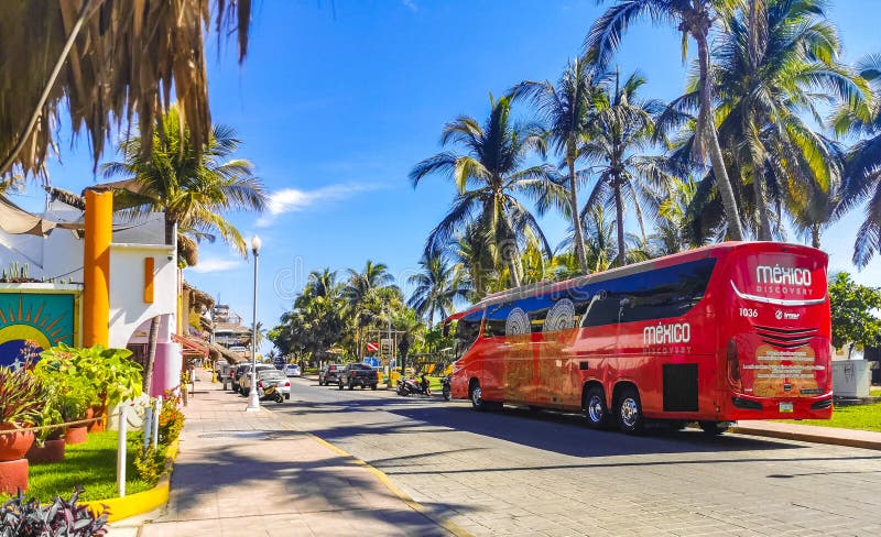 Puerto Escondido Oaxaca Mexico 20. March 2023 Various colorful buses travel tour bus and transportation in Zicatela Puerto Escondido Oaxaca Mexico. Puerto Escondido Oaxaca Mexico 20. March 2023 Various colorful buses travel tour bus and transportation in Zicatela Puerto Escondido Oaxaca Mexico