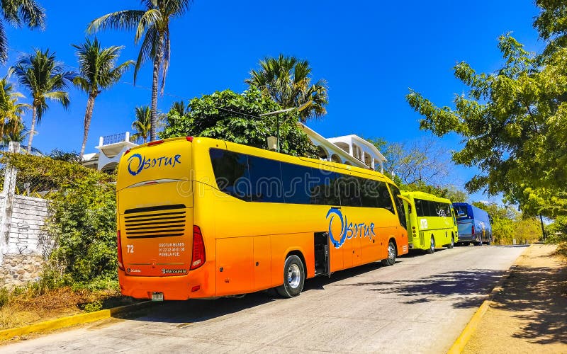 Puerto Escondido Oaxaca Mexico 25. March 2023 Various colorful buses travel tour bus and transportation in Zicatela Puerto Escondido Oaxaca Mexico. Puerto Escondido Oaxaca Mexico 25. March 2023 Various colorful buses travel tour bus and transportation in Zicatela Puerto Escondido Oaxaca Mexico