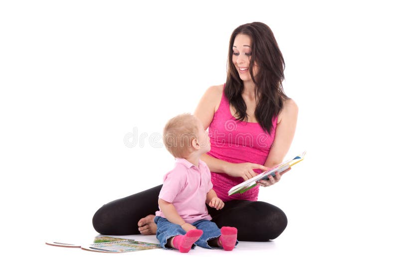 Beautiful happy mother with child 2 years boy read book. Beautiful happy mother with child 2 years boy read book