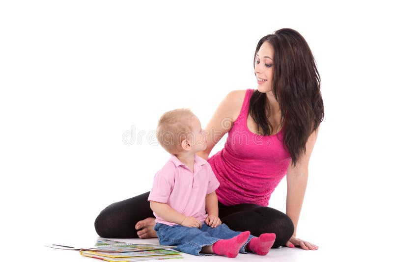 Beautiful happy mother with child 2 years boy read book. Beautiful happy mother with child 2 years boy read book