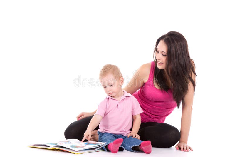 Beautiful happy mother with child 2 years boy read book. Beautiful happy mother with child 2 years boy read book