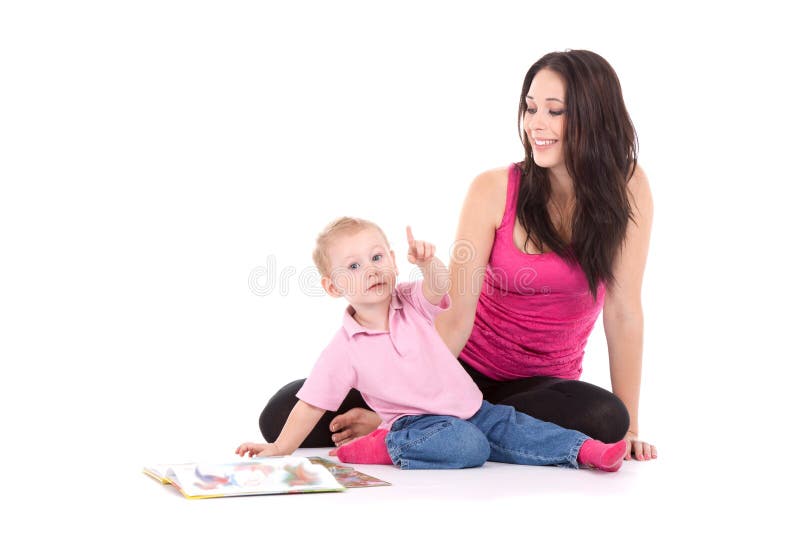 Beautiful happy mother with child 2 years boy read book. Beautiful happy mother with child 2 years boy read book