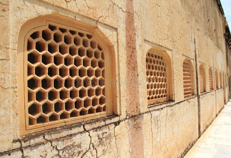 Honeycomb patterned window cover in Amber Fort, Rajasthan area, India. Honeycomb patterned window cover in Amber Fort, Rajasthan area, India.