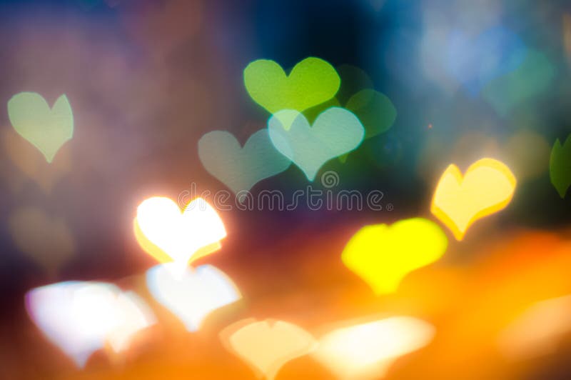 Διαμορφωμένο καρδιά υπόβαθρο Bokeh στο σκοτεινό υπόβαθρο στοκ φωτογραφία Διαμορφωμένο καρδιά υπόβαθρο Bokeh στο σκοτεινό υπόβαθρο στοκ φωτογραφία