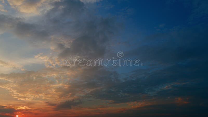 Timelapse. Different shades colored cirrus clouds during sunset. Only sky above horizon. Timelapse. Different shades colored cirrus clouds during sunset. Only sky above horizon.