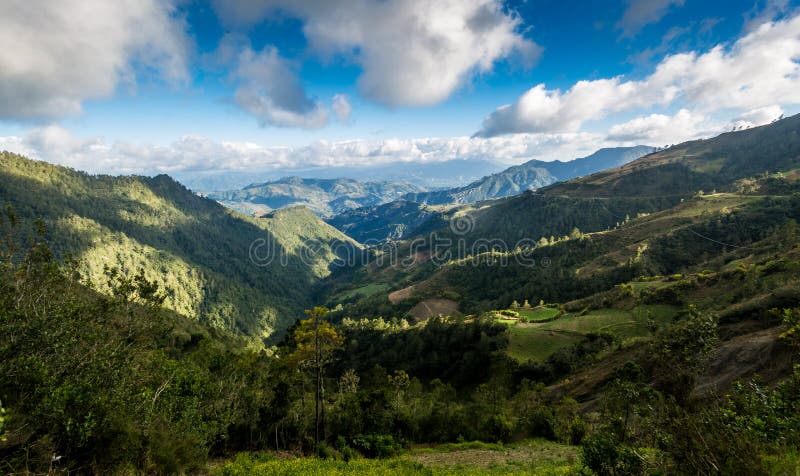 Dramatic image of mountains meadows valleys and hills high in the caribbean mountains of the dominican republic. Dramatic image of mountains meadows valleys and hills high in the caribbean mountains of the dominican republic.