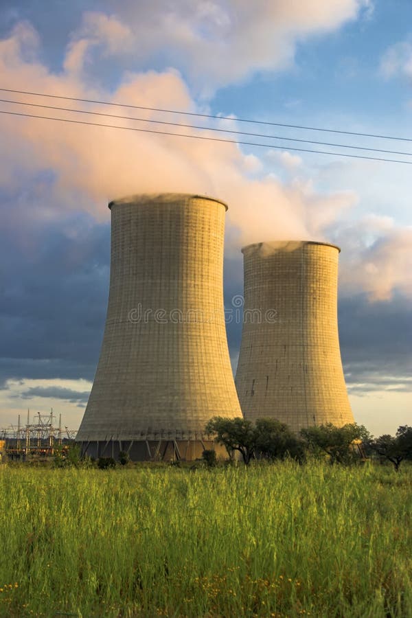 Cooling Towers at a power plant bathed by the late sun. Cooling Towers at a power plant bathed by the late sun.