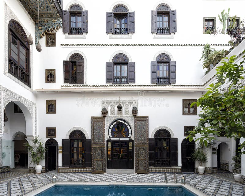 Pictured is the entrance to a room in the courtyard with pool at the Riad Maison Bleue in in Fes, Morocco. Riad Maison Bleue was created in a house dating from the 19th century whose former owner, was the late Moulay Bel Arbi El Alaoui, famous judge and professor of theology.  Today it is managed by the El Abbadi`s family. Pictured is the entrance to a room in the courtyard with pool at the Riad Maison Bleue in in Fes, Morocco. Riad Maison Bleue was created in a house dating from the 19th century whose former owner, was the late Moulay Bel Arbi El Alaoui, famous judge and professor of theology.  Today it is managed by the El Abbadi`s family.